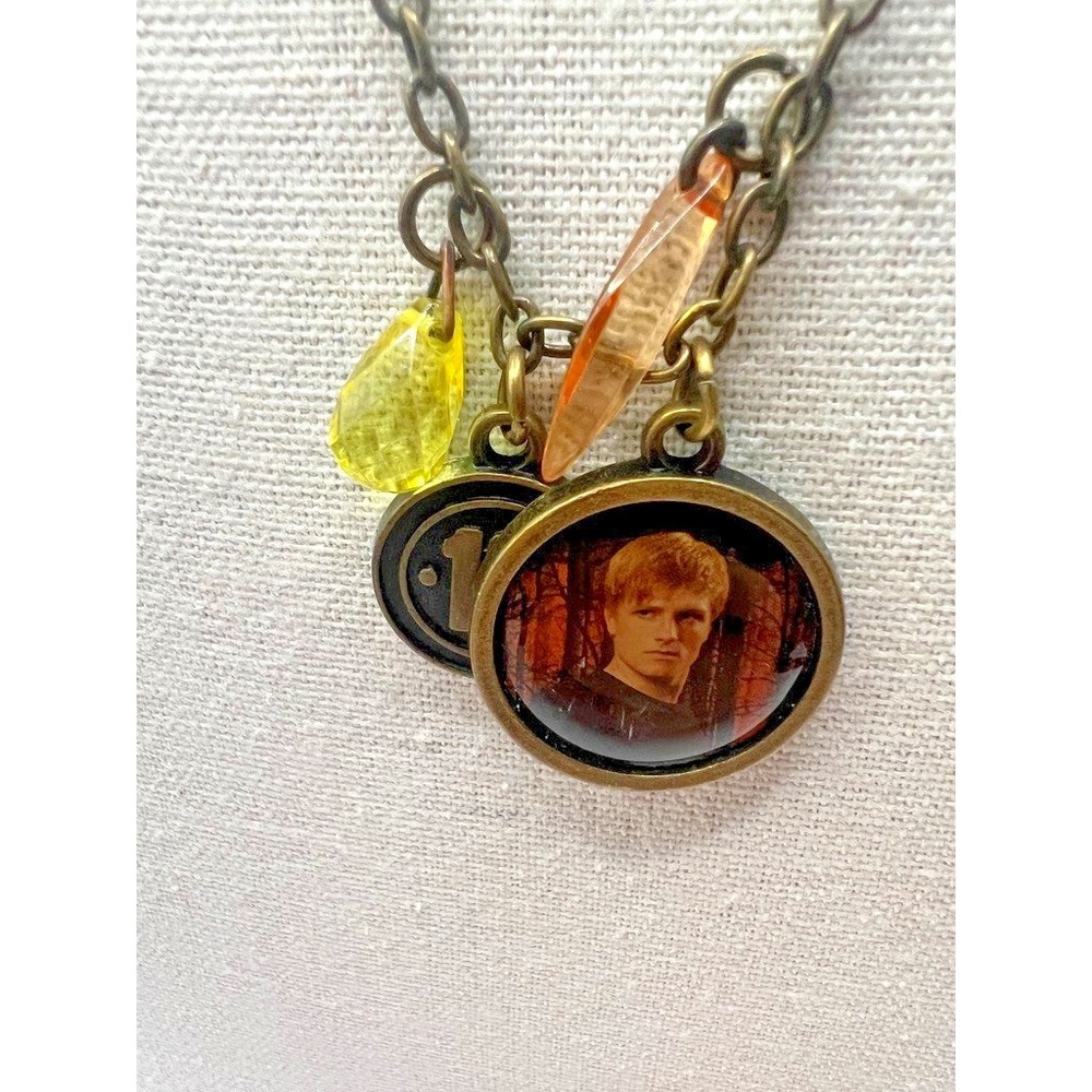 Hunger Games Necklace Peeta Medallion District 12 Official Lionsgate Official - Picture 3 of 14